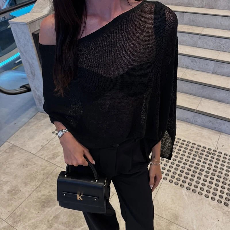 Asymmetrisk gennemsigtig ponchobluse