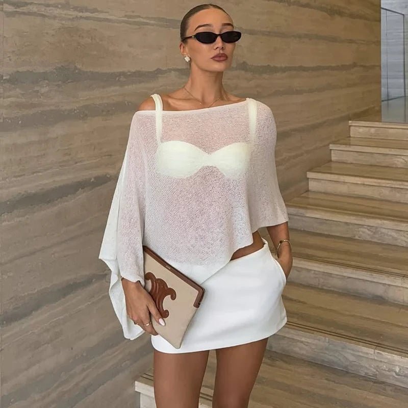 Asymmetrisk gennemsigtig ponchobluse